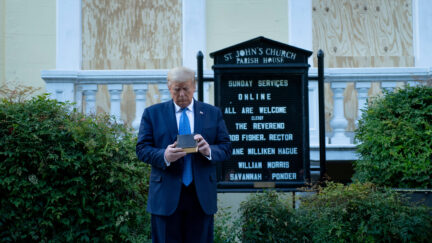 US President Donald Trump holds a Bible while visiting St. John's Church across from the White House after the area was cleared of people protesting the death of George Floyd June 1, 2020, in Washington, DC. - US President Donald Trump was due to make a televised address to the nation on Monday after days of anti-racism protests against police brutality that have erupted into violence. The White House announced that the president would make remarks imminently after he has been criticized for not publicly addressing in the crisis in recent days. (Photo by Brendan Smialowski / AFP) (Photo by BRENDAN SMIALOWSKI/AFP via Getty Images)