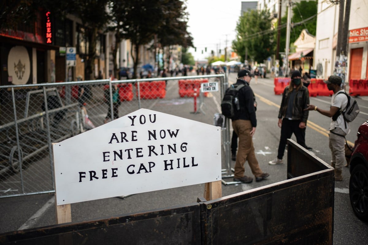 SEATTLE, WA - JUNE 10: A sign is seen on a barrier at an entrance to the so-called "Capitol Hill Autonomous Zone" on June 10, 2020 in Seattle, Washington. The zone includes the blocks surrounding the Seattle Police Departments East Precinct, which was the site of violent clashes with Black Lives Matter protesters, who have continued to demonstrate in the wake of George Floyds death. (Photo by David Ryder/Getty Images)