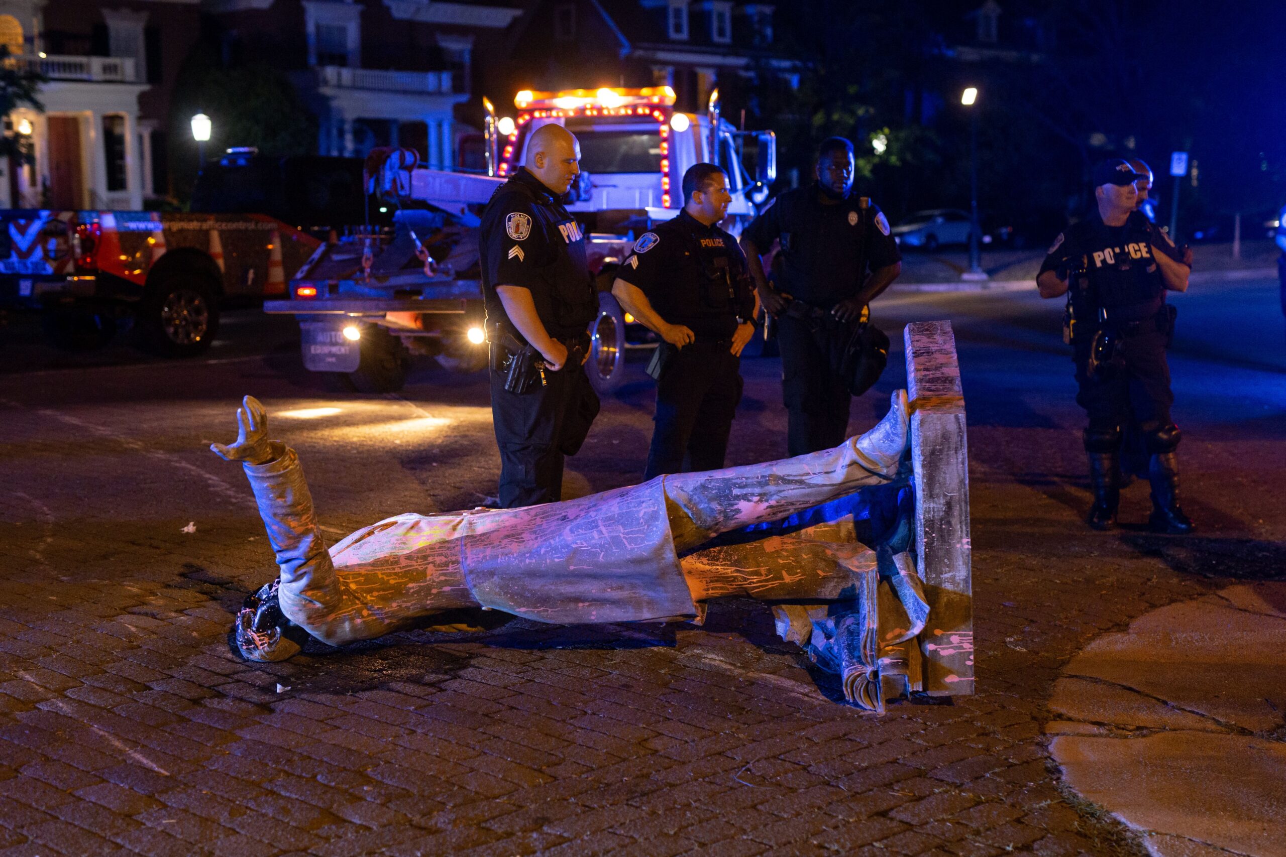 A statue of Confederate States President Jefferson Davis lies on the street after protesters pulled it down in Richmond, Virginia, on June 10, 2020. - The symbols of the Confederate States and its support for slavery are being targeted for removal following the May 25, 2020, death of George Floyd while in police custody. (Photo by Parker Michels-Boyce / AFP) (Photo by PARKER MICHELS-BOYCE/AFP via Getty Images)
