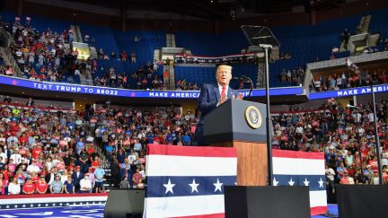 TOPSHOT - The upper section is seen partially empty as US President Donald Trump speaks during a campaign rally at the BOK Center on June 20, 2020 in Tulsa, Oklahoma. - Hundreds of supporters lined up early for Donald Trump's first political rally in months, saying the risk of contracting COVID-19 in a big, packed arena would not keep them from hearing the president's campaign message. (Photo by Nicholas Kamm / AFP) (Photo by NICHOLAS KAMM/AFP via Getty Images)