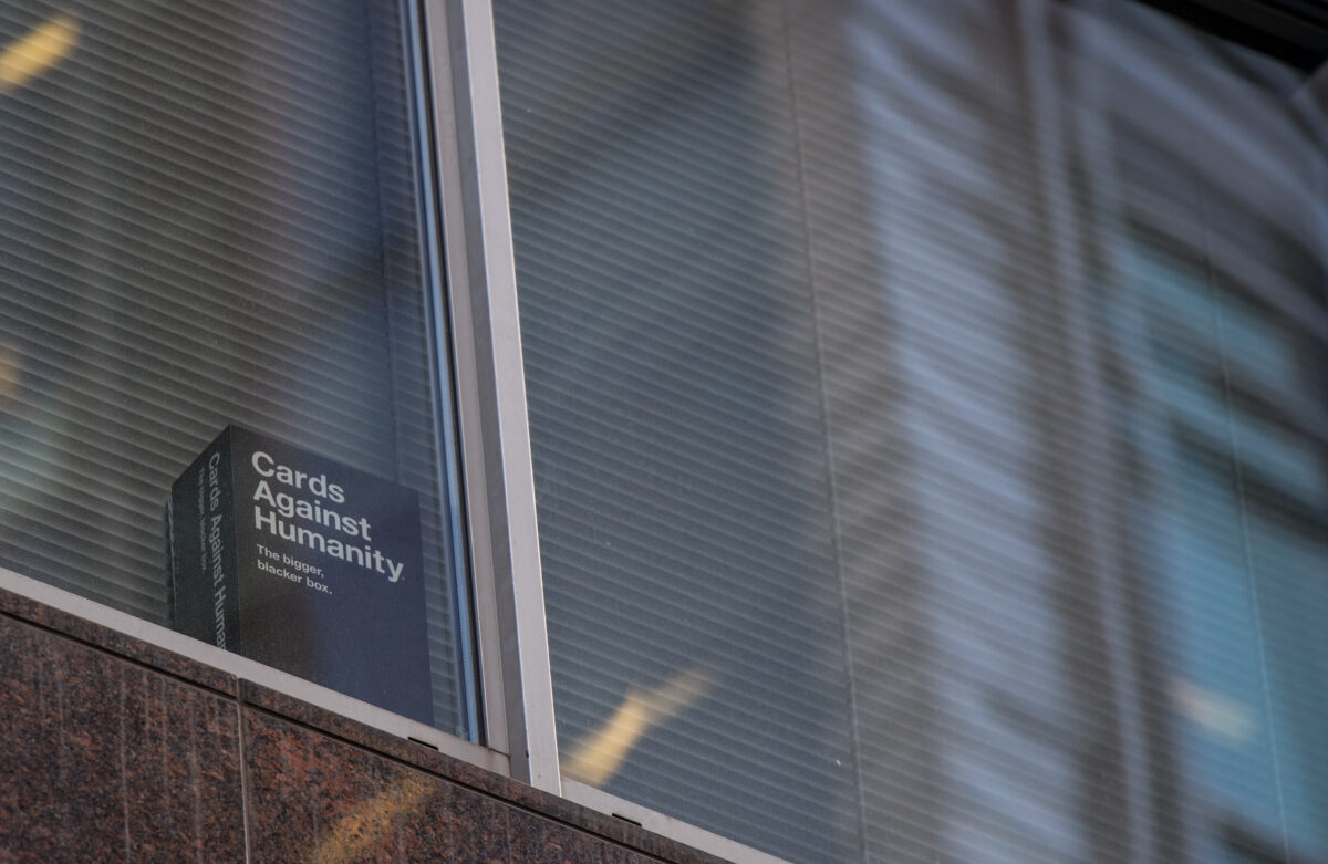LONDON, ENGLAND - MARCH 21: A copy of the game 'Cards Against Humanity' is seen in a the window of the floor occupied by company Cambridge Analytica on March 21, 2018 in London, England. UK authorities are currently seeking a warrant to search the premises of Cambridge Analytica after the company has been involved in a row over its use of Facebook data. Their CEO Alexander Nix has since been suspended. (Photo by Chris J Ratcliffe/Getty Images)
