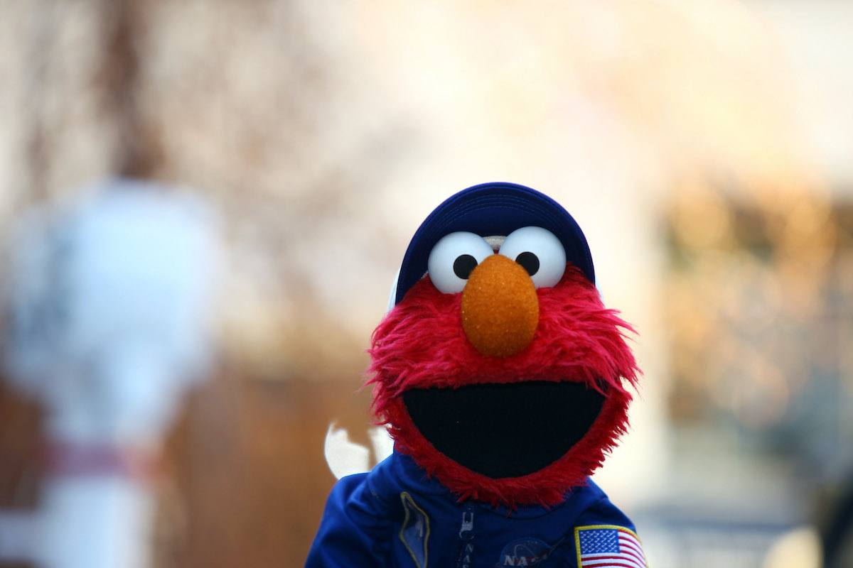 Elmo wears a NASA outfit.