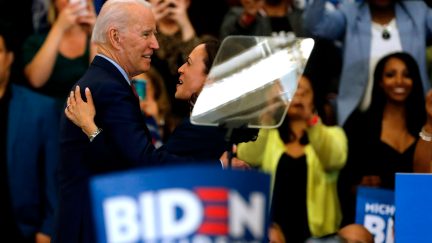 California Senator Kamala Harris (C) hugs Democratic presidential candidate former Vice President Joe Biden after she endorsed him at a campaign rally at Renaissance High School in Detroit, Michigan on March 9, 2020. (Photo by JEFF KOWALSKY / AFP) (Photo by JEFF KOWALSKY/AFP via Getty Images)