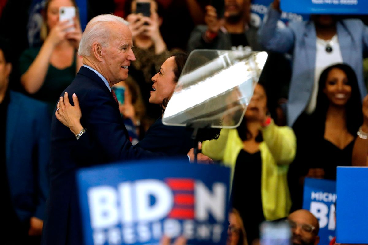 California Senator Kamala Harris (C) hugs Democratic presidential candidate former Vice President Joe Biden after she endorsed him at a campaign rally at Renaissance High School in Detroit, Michigan on March 9, 2020. (Photo by JEFF KOWALSKY / AFP) (Photo by JEFF KOWALSKY/AFP via Getty Images)