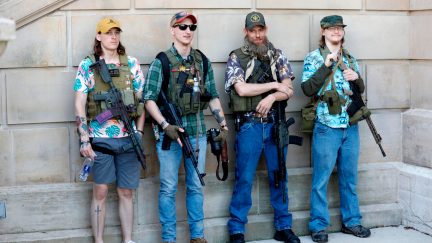 Armed protesters demonstrate during the Michigan Conservative Coalition organized 