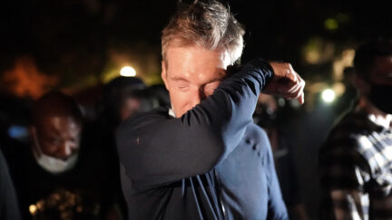PORTLAND, OR - JULY 22: Portland Mayor Ted Wheeler reacts after being exposed to tear gas fired by federal officers while attending a protest against police brutality and racial injustice in front of the Mark O. Hatfield U.S. Courthouse on July 22, 2020 in Portland, Oregon. State and city elected officials have called for the federal officers to leave Portland as clashes between protesters and federal police continue to escalate. (Photo by Nathan Howard/Getty Images)