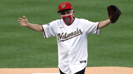 Dr. Anthony Fauci, director of the National Institute of Allergy and Infectious Diseases reacts after throwing out the ceremonial first pitch prior to the game between the New York Yankees and the Washington Nationals