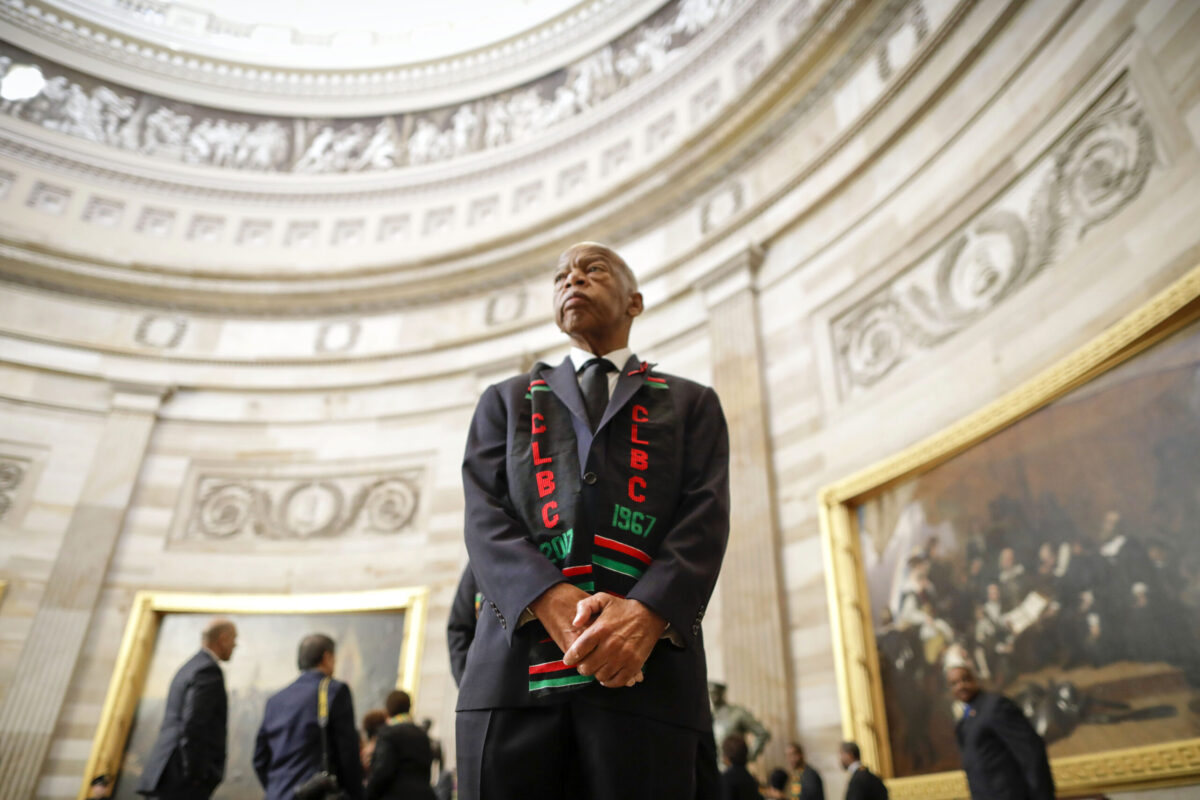 John Lewis stands in the Capitol rotunda.