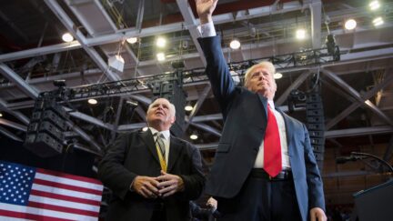 US President Donald Trump alongside radio talk show host Rush Limbaugh arrive at a Make America Great Again rally in Cape Girardeau, Missouri on November 5, 2018. (Photo by Jim WATSON / AFP) (Photo credit should read JIM WATSON/AFP via Getty Images)