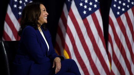 Democratic vice presidential running mate, US Senator Kamala Harris, smiles as she listens to presidential nominee and former US Vice President Joe Biden speak during their first press conference together in Wilmington, Delaware, on August 12, 2020. (Photo by Olivier DOULIERY / AFP) (Photo by OLIVIER DOULIERY/AFP via Getty Images)