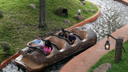 Social distancing seating measures are in place as people wearing facemasks ride Splash Mountain at Walt Disney World Resort's Magic Kingdom during the COVID-19 pandemic in Orlando on July 23, 2020. - The United States on July 23 recorded 76,570 new coronavirus cases in the previous 24 hours, Johns Hopkins University reported, after the nation's total number of infections topped four million earlier in the day. The US has seen a coronavirus surge, particularly in southern and western states, as Texas, California, Alabama, Idaho and Florida all announced record one-day death tolls. (Photo by Bryan R. Smith / AFP) (Photo by BRYAN R. SMITH/AFP via Getty Images)