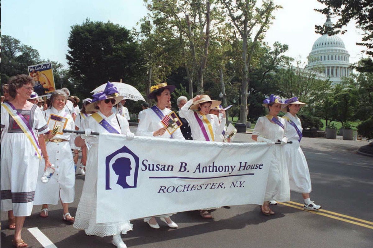 A delegation from the Susan B. Anthony House in Rochester, New York marches in the Women's Rights March