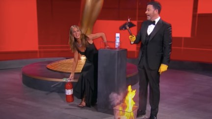 Jennifer Aniston and Jimmy Kimmel battle a literal trash fire on stage at the 2020 Emmy Awards.
