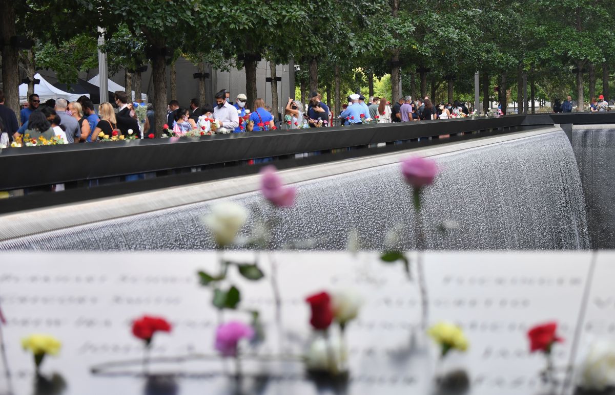 People gather at the 9/11 Memorial & Museum in New York on September 11, 2020, as the US commemorates the 19th anniversary of the 9/11 attacks. (Photo by Angela Weiss / AFP) (Photo by ANGELA WEISS/AFP via Getty Images)