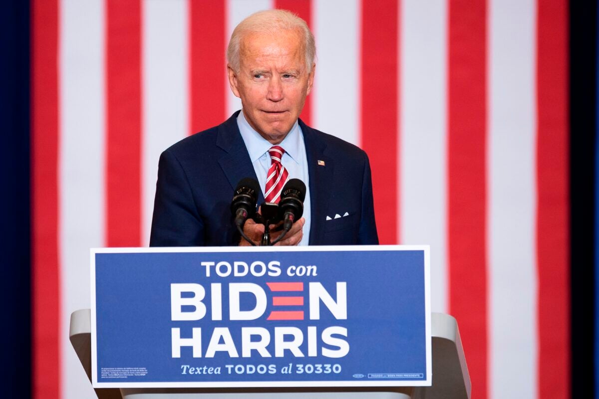 Democratic Presidential Candidate Joe Biden plays music from his cell phone as he participates in a Hispanic Heritage Month event at the Osceola Heritage Park in Kissimmee, Florida on September 15, 2020. (Photo by JIM WATSON / AFP) (Photo by JIM WATSON/AFP via Getty Images)
