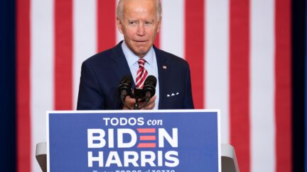 Democratic Presidential Candidate Joe Biden plays music from his cell phone as he participates in a Hispanic Heritage Month event at the Osceola Heritage Park in Kissimmee, Florida on September 15, 2020. (Photo by JIM WATSON / AFP) (Photo by JIM WATSON/AFP via Getty Images)