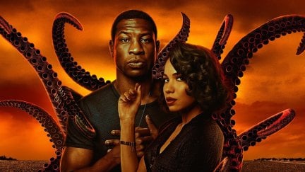 Letitia and Atticus stand together, with tentacles reaching out behind them, in poster art for HBO's Lovecraft Country.