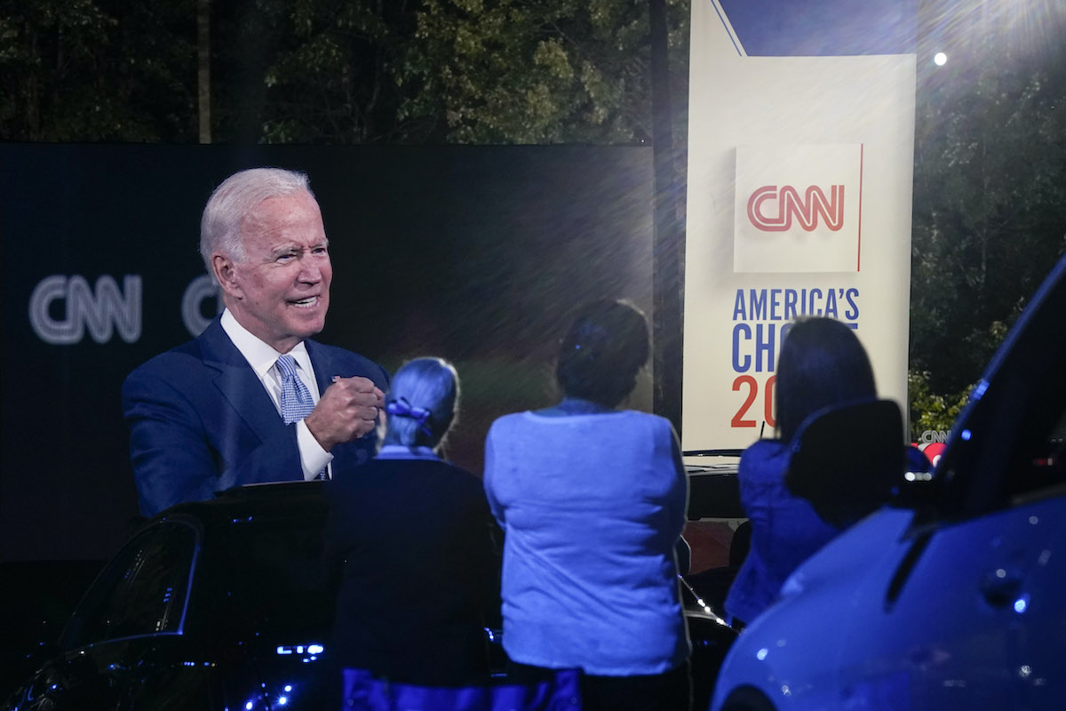 Joe Biden is projected onto a drive-in screen for CNN's town hall event.