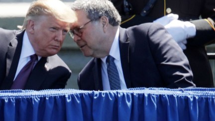 Donald Trump listens as Attorney General William Barr speaks into his ear.