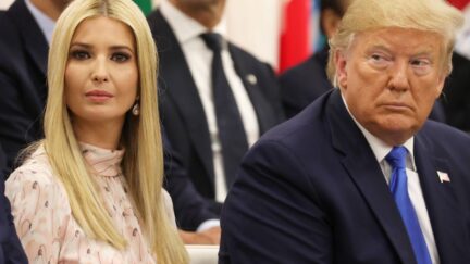 Donald and Ivanka Trump sit next to each other at an event.