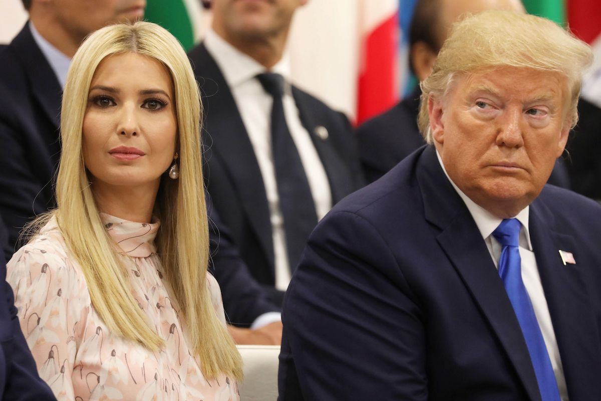 Donald and Ivanka Trump sit next to each other at an event.