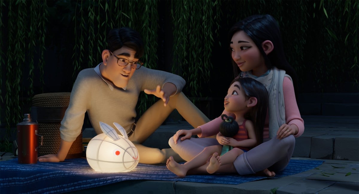 OVER THE MOON - (L-R) "Father" (voiced by John Cho), "Fei Fei" (voiced by Cathy Ang) and "Mother" (voiced by Ruthie Ann Miles). © 2020 Netflix, Inc.