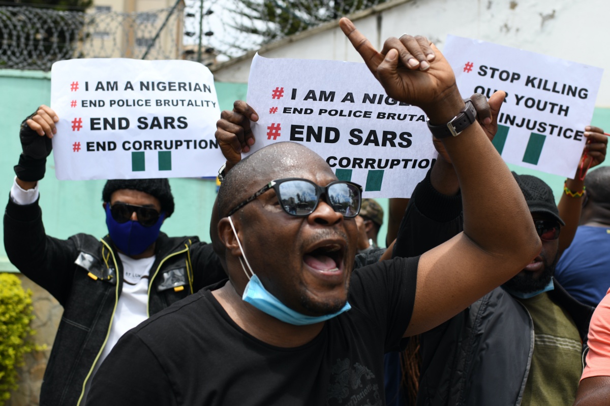 Nigerians based in Kenya protest outside the Nigerian embassy in Nairobi, Kenya, on October 21, 2020 in solidarity with Nigerian youth who are demanding an end to police brutality in the form of The Nigerian Police Force Unit, Special Anti-Robbery Squad (SARS). (Photo by Simon MAINA / AFP) (Photo by SIMON MAINA/AFP via Getty Images)