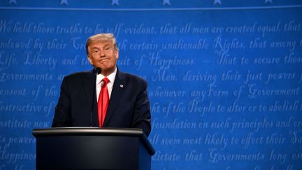 Donald Trump reacts during the final presidential debate