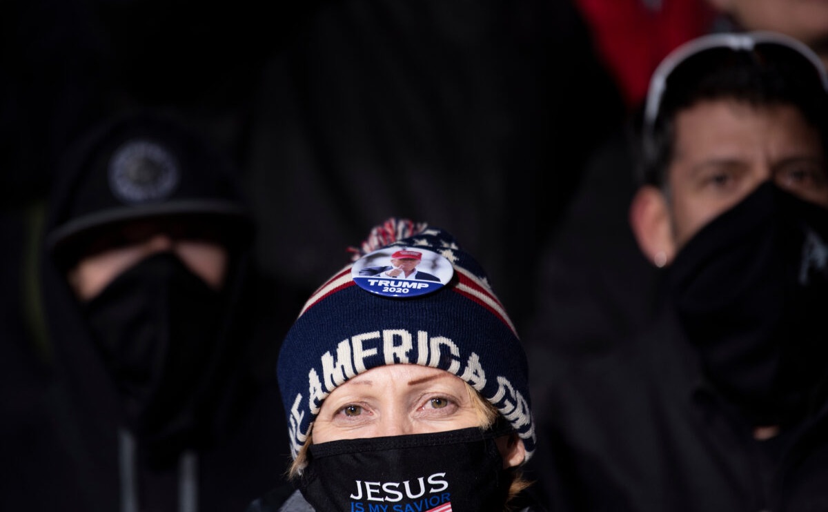 People watch as President Donald Trump speaks during a Make America Great Again rally at Eppley Airfield on October 27, 2020, in Omaha, Nebraska