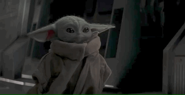 baby yoda trying to eat the eggs