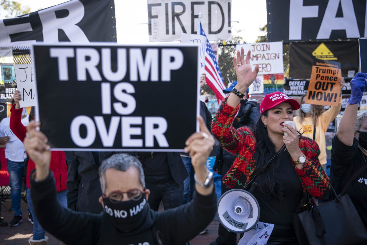 WASHINGTON, DC - NOVEMBER 13: Supporters of U.S. President Donald Trump and counter protesters demonstrate outside of the White House ahead of Saturday's Million MAGA March on November 13, 2020 in Washington, DC. Supporters clashed with protesters organized by Shutdown DC at Black Lives Matter Plaza.