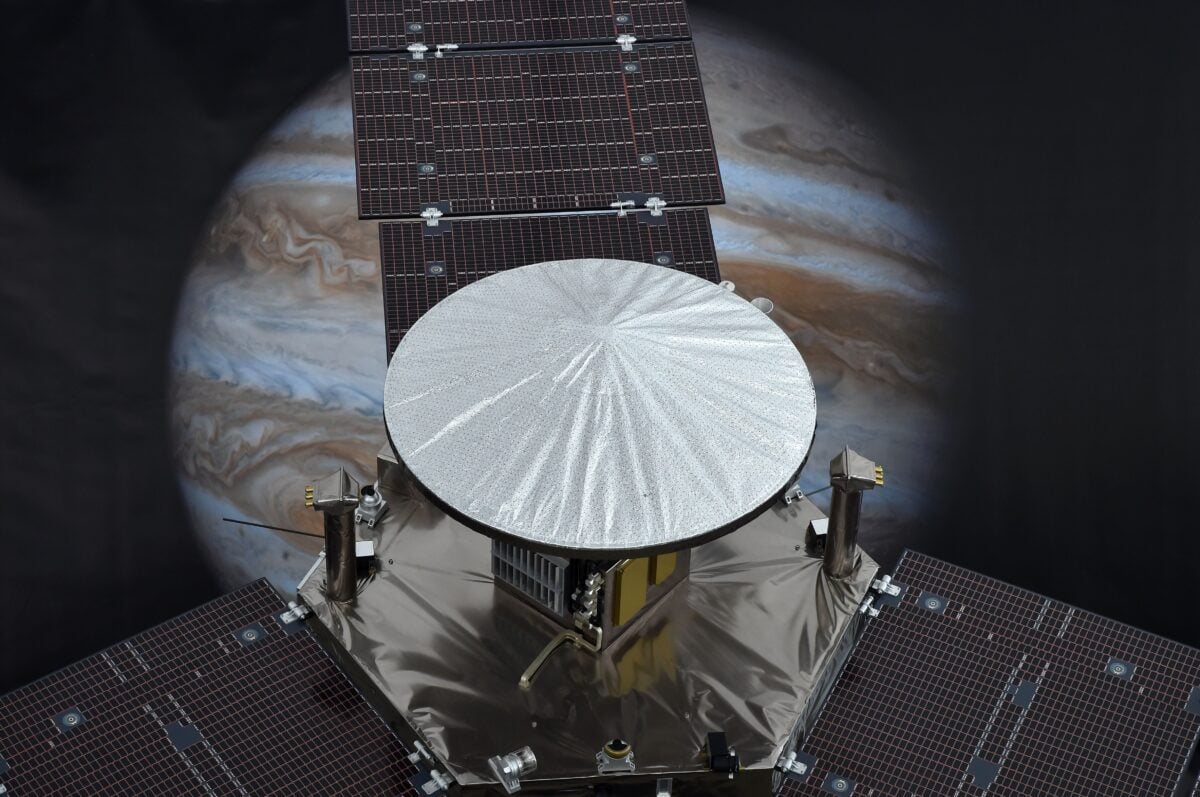 A 1/4 scale model of NASA's Juno Spacecraft is seen in front of an image of Jupiter, at the Jet Propulsion Laboratory (JPL) in Pasadena, California, July 3, 2016. NASA's solar-powered Juno spacecraft is scheduled to enter into orbit around Jupiter on July 4 to begin an in-depth study of the planet's formation, evolution and structure. The key event on July 4 is a 35-minute engine burn at 11:18 p.m. EDT (0318 GMT on Tuesday), which is designed to slow Juno down enough to be captured by Jupiter's powerful gravity. / AFP / Robyn Beck (Photo credit should read ROBYN BECK/AFP via Getty Images)