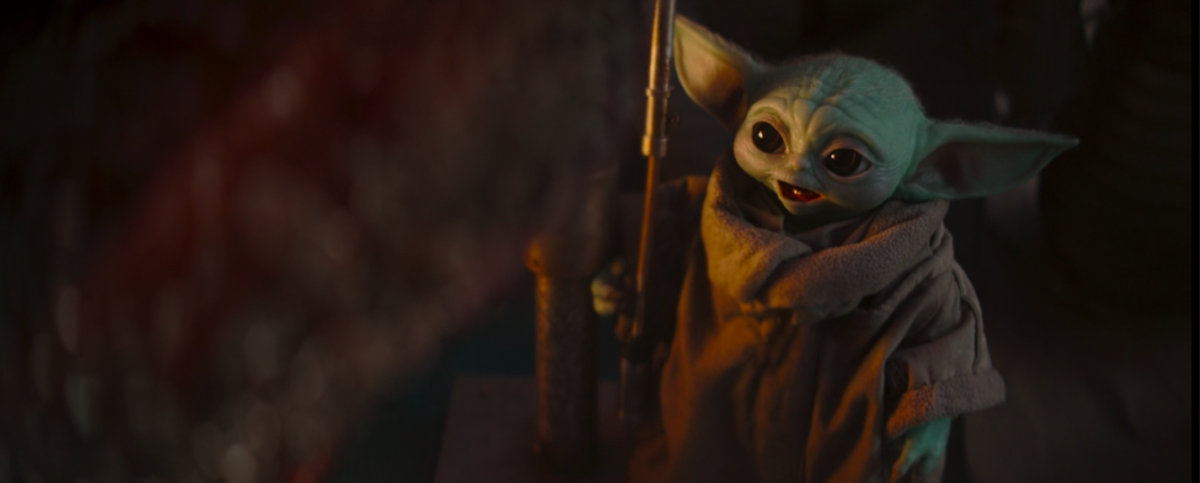 baby yoda looking at meat