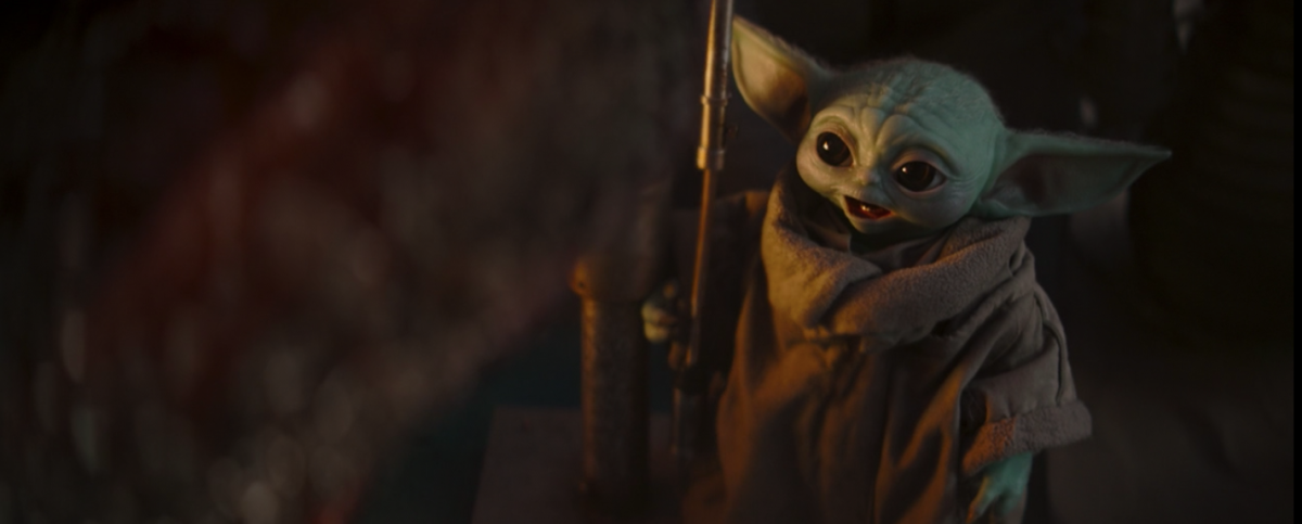 baby yoda looking at meat