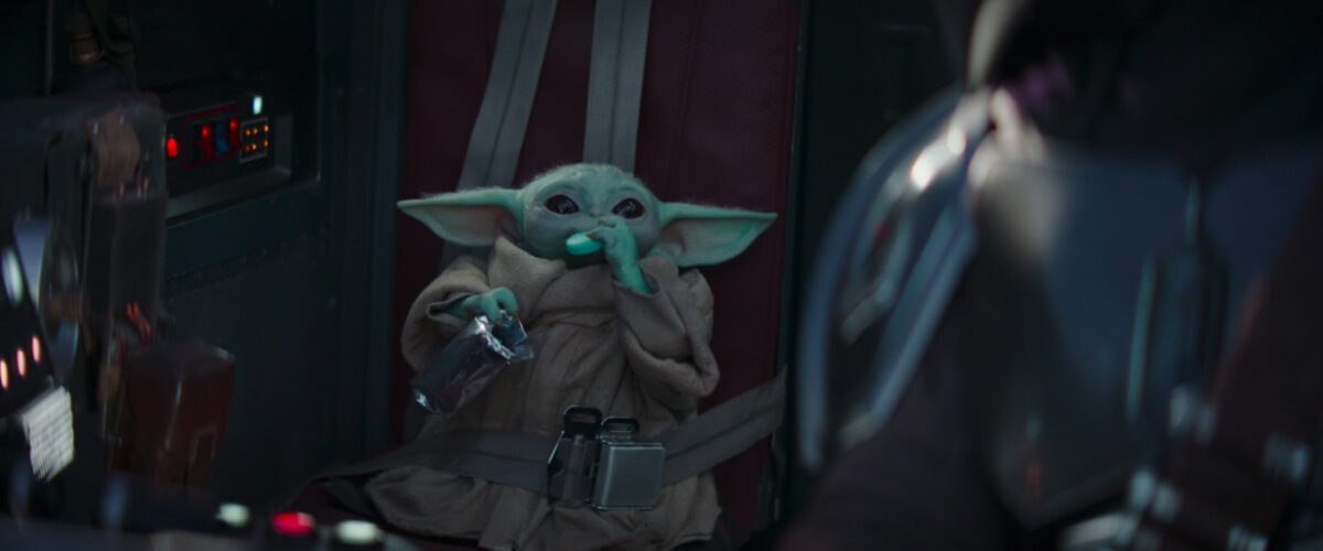 baby yoda eating on ship