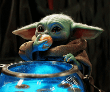 baby yoda eating eggs