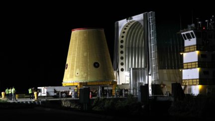 A Launch Vehicle Stage Adapter (LVSA) for the Artemis-1 mission is unloaded from a barge at Cape Canaveral Air Force Station in Florida before sunrise on July 30, 2020. - Built exclusively at NASAs Marshall Space Flight Center in Huntsville, Alabama, the three-story structure is a critical piece of the Space Launch System (SLS) rocket for the Artemis-1 mission, an uncrewed test flight which will carry the Orion spacecraft to the Moon and back in 2021. The SLS rocket will also carry 13 small satellites that will perform their own science and technology investigations. (Photo by Gregg Newton / Gregg Newton / AFP) (Photo by GREGG NEWTON/Gregg Newton/AFP via Getty Images)