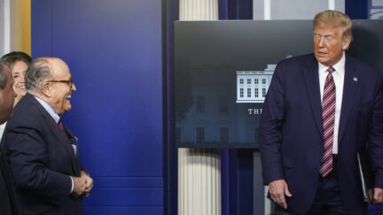 WASHINGTON, DC - SEPTEMBER 27: Former New York Mayor Rudy Giuliani stands as U.S. President Donald Trump arrives for a news conference in the Briefing Room of the White House on September 27, 2020 in Washington, DC. Trump is preparing for the first presidential debate with former Vice President and Democratic Nominee Joe Biden on September 29th in Cleveland, Ohio. (Photo by Joshua Roberts/Getty Images)