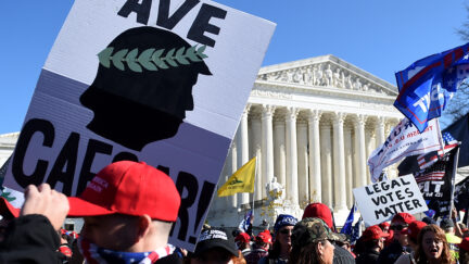 Supporters of US President Donald Trump rally at the US Supreme Court in Washington, DC, on November 14, 2020. - Supporters are backing Trump's claim that the November 3 election was fraudulent. (Photo by Olivier DOULIERY / AFP) (Photo by OLIVIER DOULIERY/AFP via Getty Images)