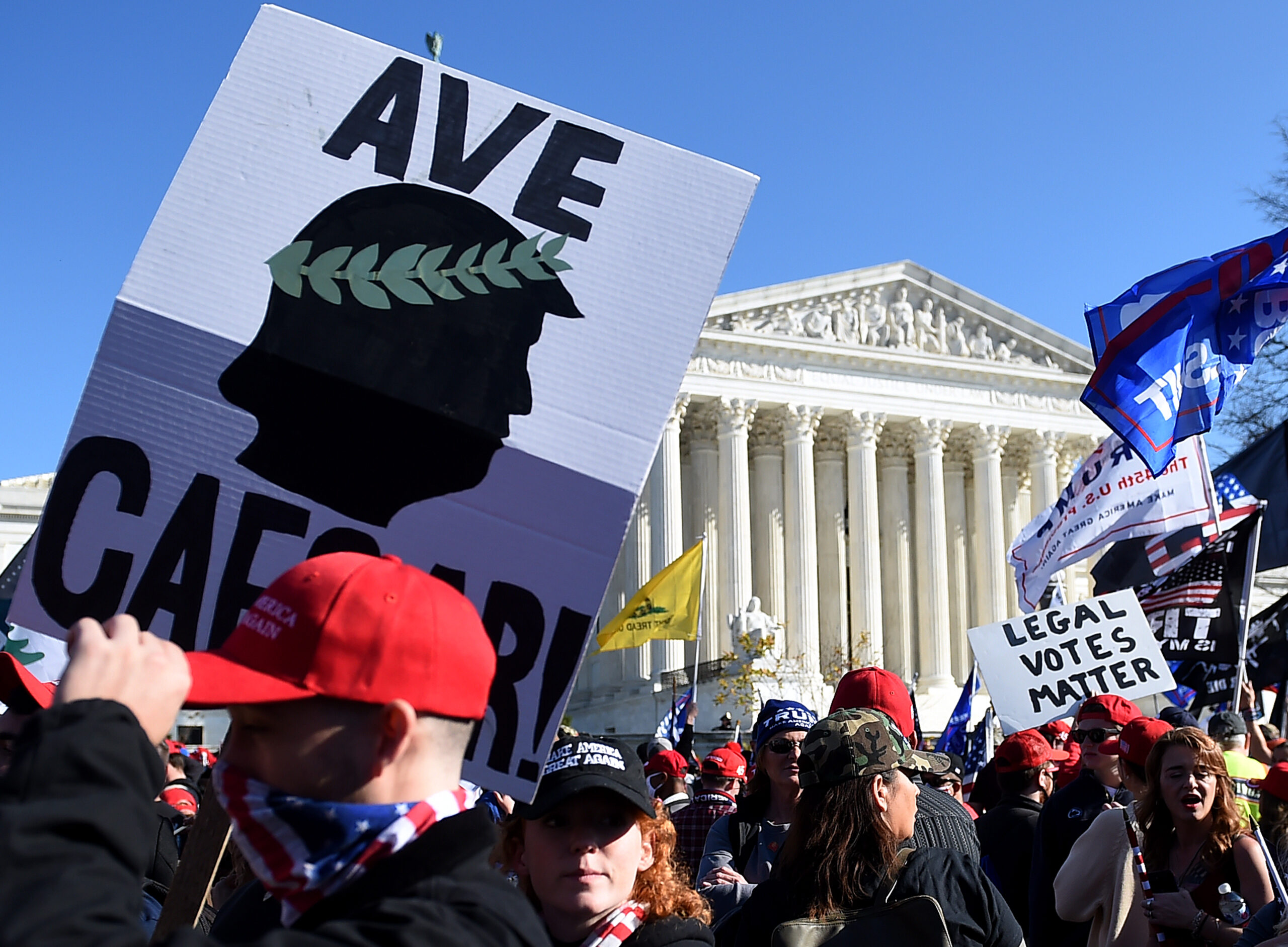 Supporters of US President Donald Trump rally at the US Supreme Court in Washington, DC, on November 14, 2020. - Supporters are backing Trump's claim that the November 3 election was fraudulent. (Photo by Olivier DOULIERY / AFP) (Photo by OLIVIER DOULIERY/AFP via Getty Images)
