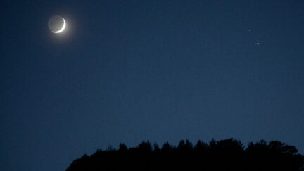 ANTALYA, TURKEY - DECEMBER 17: A crescent moon (L) is seen with Saturn (upper right) and Jupiter (lower right) ahead of their closest visible conjunction on December 17, 2020 in Antalya, Turkey. On December 21, a Jupiter and Saturn conjunction will form a rare 