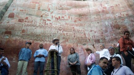 Colombian President Juan Manuel Santos speaks during a press conference to announce the expansion by 1.5 million hectares of the Chiribiquete National Park -named UNESCO's World Heritage site on the eve- at the Cerro Azul in the Serrania La Lindosa, department of Guaviare, Colombia, on July 2, 2018. - Both the Serranias of Chiribiquete and La Lindosa had been closed to outsiders for many years during the armed conflict and are now opening up to scientific research. (Photo by Diana Sanchez / AFP) (Photo credit should read DIANA SANCHEZ/AFP via Getty Images)