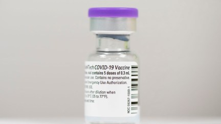 Closeup of a vial of COVID-19 vaccine.