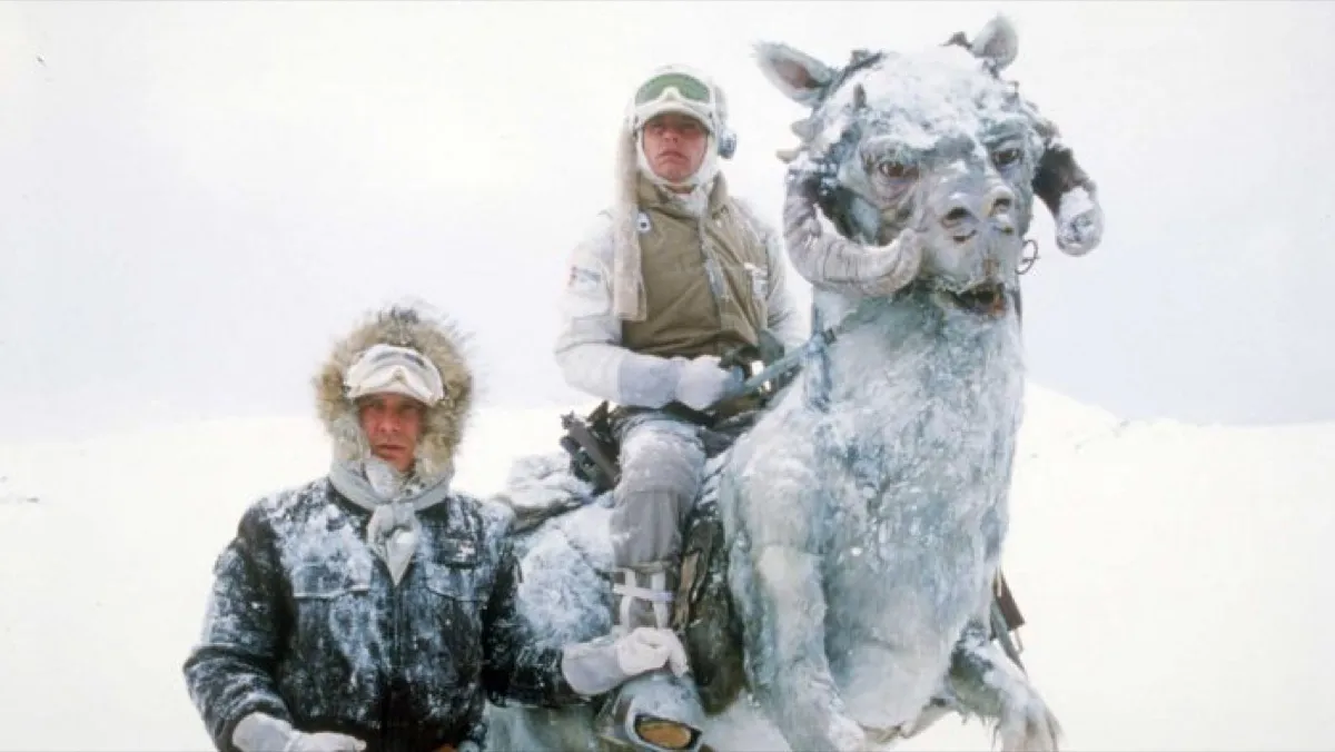 Han Solo and Luke Skywalker with a tauntaun in the snow of Hoth in Star Wars: The Empire Strikes Back.