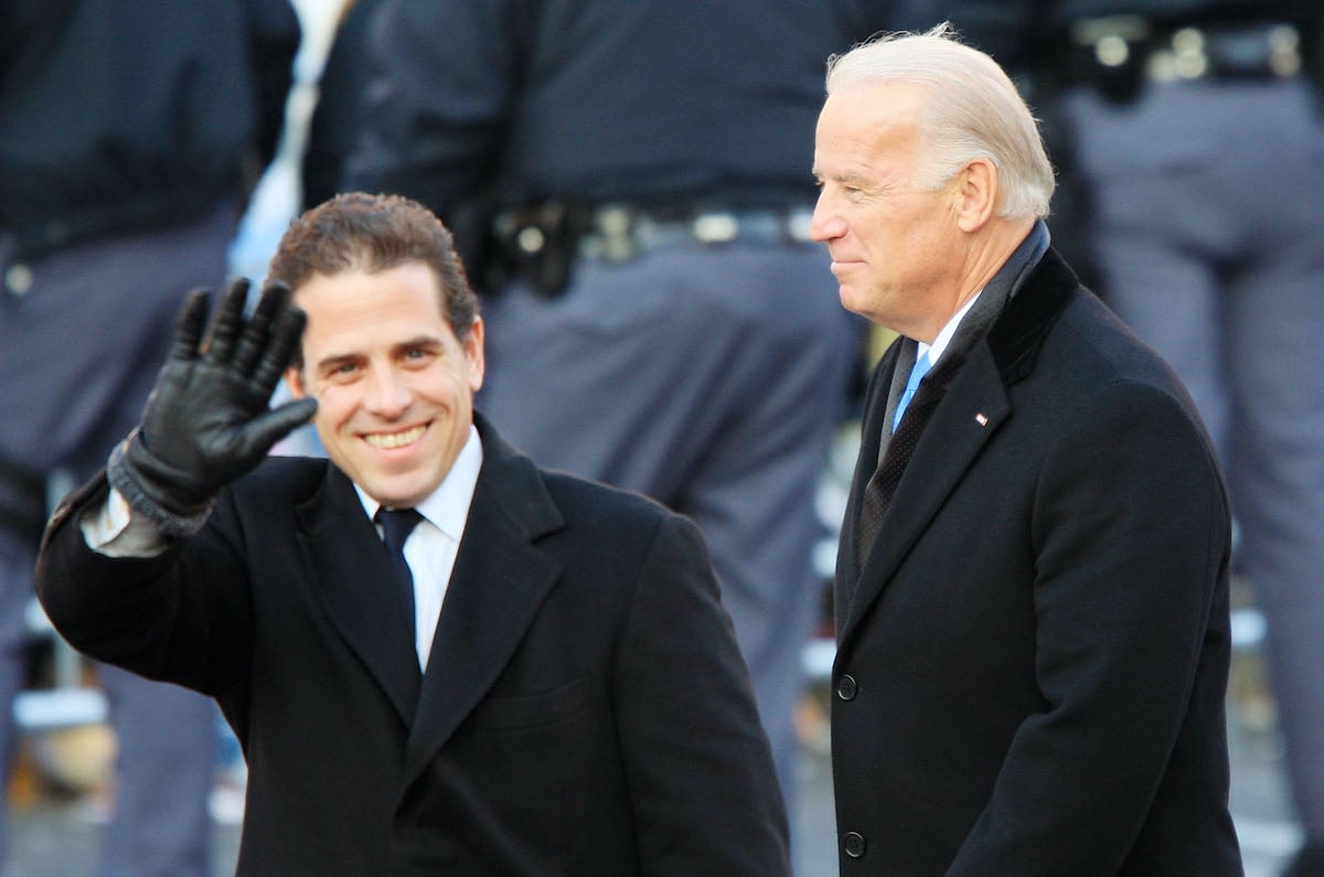 Joe and Hunter Biden wave as they arrive at Obama's inauguration.
