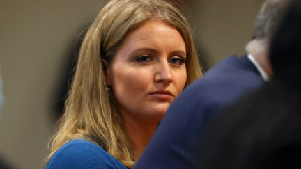 Jenna Ellis, a member of U.S. President Donald Trump's legal team, listens to Detroit poll worker Jessi Jacobs during an appearance before the Michigan House Oversight Committee
