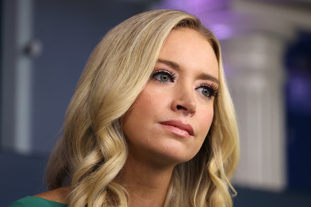 Kayleigh McEnany listens during a press briefing.