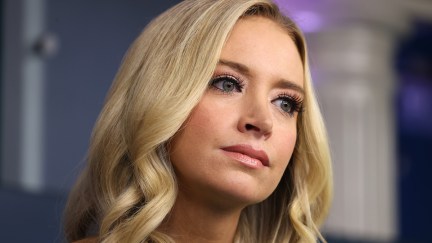 Kayleigh McEnany listens during a press briefing.