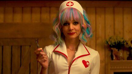 Cassie dressed as a nurse, holding up a scalpel in Promising Young Woman.