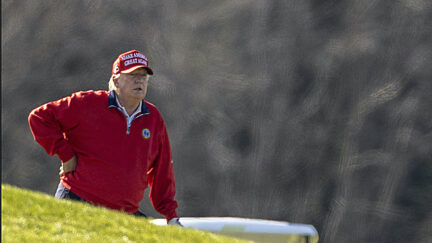Donald Trump rests on the golf course.